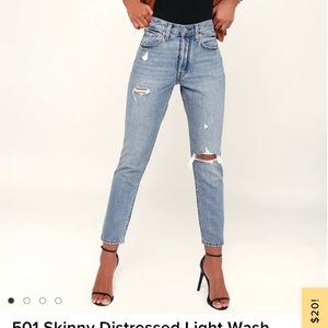 Levi’s 501 distressed light wash jeans